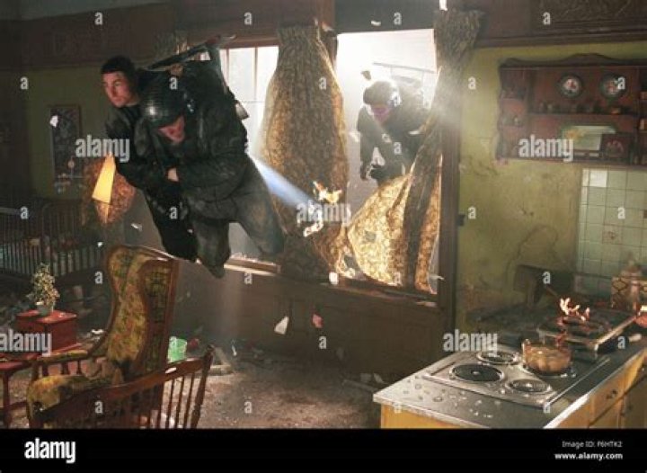 Who does John Anderton kidnap from the precrime building?